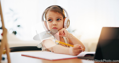 Image of Thinking, kid on headphones and education, writing in book and homework for homeschool on tablet. Elearning, virtual class and idea of girl child on internet, studying and online lesson for knowledge