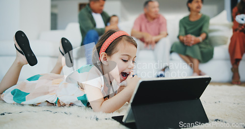 Image of Girl child, happy and tablet on floor in family home for movie, streaming subscription and relax in living room. Kid, digital touchscreen and smile on carpet with cartoon, video or learning in house