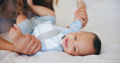 Image of Hands, love and baby in bed with mother at home, play and bonding together, support or family trust. Child, mom and closeup of infant in bedroom, smile and security, care of toddler and growth of kid