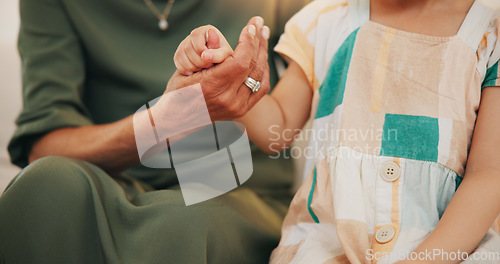 Image of Child, grandmother and hand closeup as care safety or love together for bonding, protection or relax. Young kid, old woman and fingers or family help connection in retirement, embrace for development