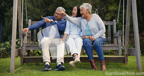 Image of Father, senior or mother with woman on bench in nature pointing, talking or speaking in retirement. Dad, mature parents or daughter in conversation with bond together in park or garden as a family