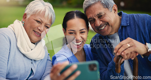 Image of Happy woman, doctor and senior couple in selfie for photography, elderly care or retirement in nature. Medical nurse or caregiver smile with mature people for picture, photograph or memory at park