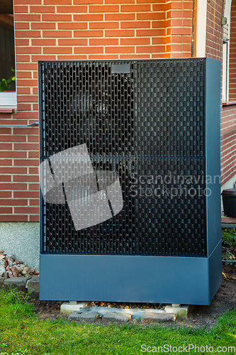 Image of Air source heat pump installed outside in a garden