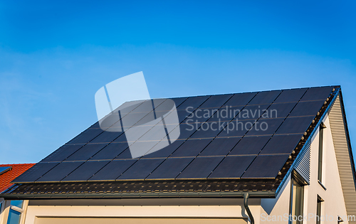 Image of Photovoltaic panels on the roof of family house, solar panels. 