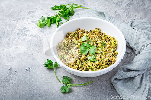 Image of Roasted organic cauliflower and broccoli rice with herbs - paleo and ketogenic diet concept