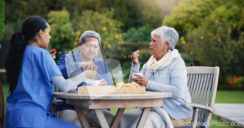 Image of Nurse, eating or breakfast for elderly care, retirement or healthcare support at park or nature. Caregiver, senior man or old woman with tea, meal or outdoor snack together in health and wellness