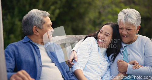 Image of Senior, parents and woman in garden with hug, support and love in backyard and retirement. Happy family, elderly father and mother embrace daughter on bench in summer, park or bonding on vacation