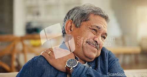 Image of Senior man, shoulder and pain in home from arthritis, osteoporosis and tired joints, muscle and medical emergency. Face of elderly guy massage arm for injury, fibromyalgia or help for healthcare risk