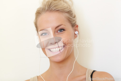 Image of Portrait, college student and listening to music with earphones and relax with technology in home. Streaming, radio or podcast audio with headphones, tech and happy woman hearing sound in apartment