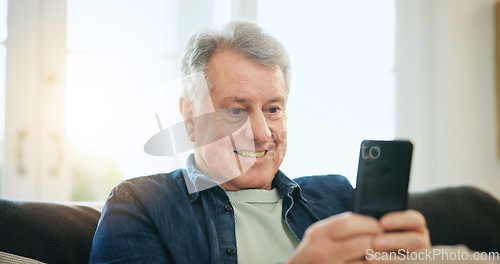 Image of Happy senior man, phone and relax on sofa for communication, good news or networking at home. Mature male person smile on mobile smartphone for online chatting, texting or search on couch at house