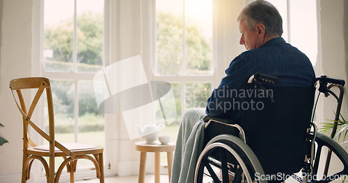 Image of Wheelchair, senior man or thinking of memory by window in nursing home or retirement with depression. Nostalgia, sad history or lonely mature person in lounge by an empty chair to remember past loss