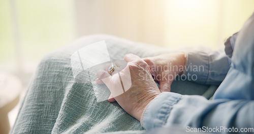 Image of Senior, woman and hand with closeup in retirement home for comfort, care or support for nostalgia of past. Elderly patient, alone and depression for bad mental health, stress or anxiety with worry