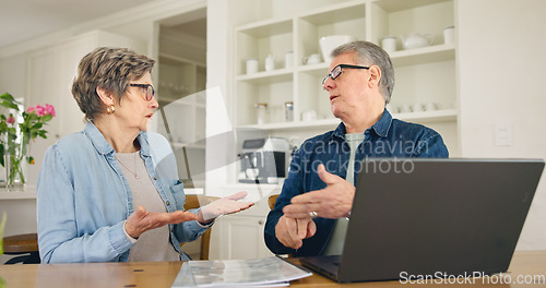 Image of Laptop, budget and stress with a senior couple in their home together, talking about accounting or finance. Tax, debt or financial crisis with an elderly man and woman in disagreement about money