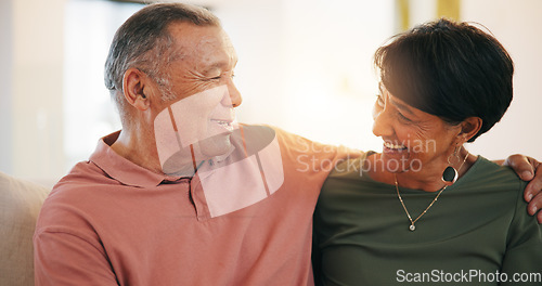 Image of Retirement, couple and hug with love in morning, home or conversation with support in living room. Mature, people and talking together with embrace on sofa in lounge of apartment or vacation in house