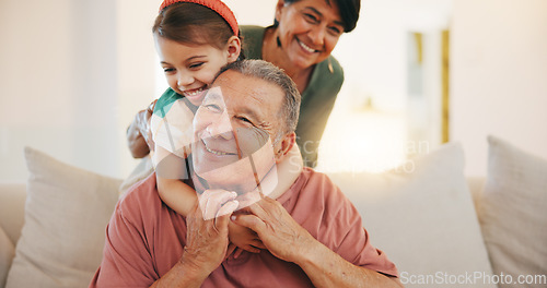 Image of Grandparents, child and play with smile, home and embrace with love, grandchild and couch. Man, woman and lounge or bonding together for relationship, family and retired with girl, house and kid