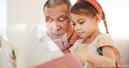 Image of Grandparent, kid and reading book with smile, home and child development, grandchild and couch. Man, lounge or bonding together for relationship, family and retired with girl, house and happy