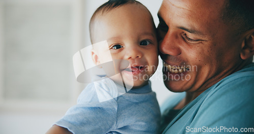 Image of Happy, love and father hug baby with a smile, support or security in their home together. Family, newborn and face of playful infant with dad in a house for embrace, moment or playing games with care