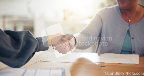 Image of People, handshake and meeting for retirement plan, documents or paperwork in deal or insurance at home. Closeup of senior woman shaking hands with attorney or lawyer for legal agreement at house