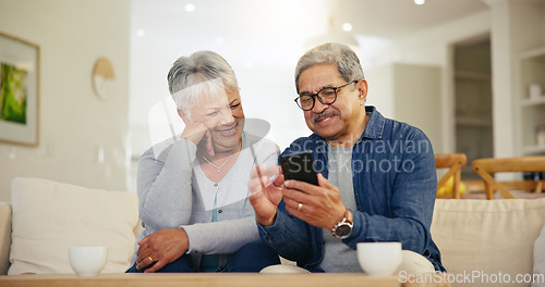 Image of Senior couple, smartphone and social media with smile, conversation and living room sofa. Grandparents, technology and communication with family, man and woman in retirement, happy and connection