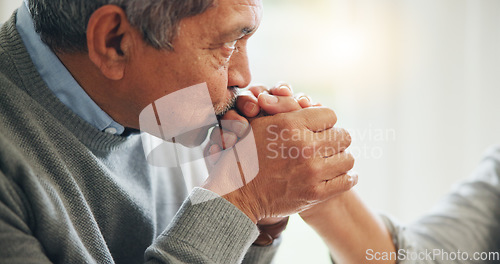 Image of Home, kissing hand and senior couple with love, marriage and romance with celebration, bonding together and care. Support, old man and elderly woman with relationship, anniversary and trust with joy