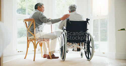 Image of Elderly man, comfort and woman in wheelchair, touch and support partner in retirement with love. Senior couple, care and hand for together in marriage, sickness and health for wellness in family home