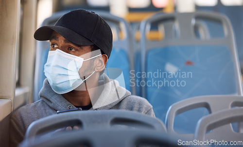 Image of Man, mask or thinking in bus in city, cold protection or window view on trip for wellness. Young person, cap or medical cover on mouth for flu virus, transport safety or healthcare rules on vehicle