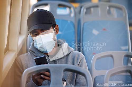 Image of Man in bus with mask, phone and morning travel in city, checking service schedule or social media post. Public transport safety in covid, urban commute and person in seat with smartphone connection.