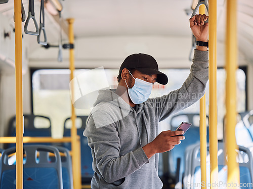 Image of Man in bus with mask, mobile app and travel to city in morning, checking service schedule or social media. Public transport safety in covid, urban commute and person in standing with phone connection