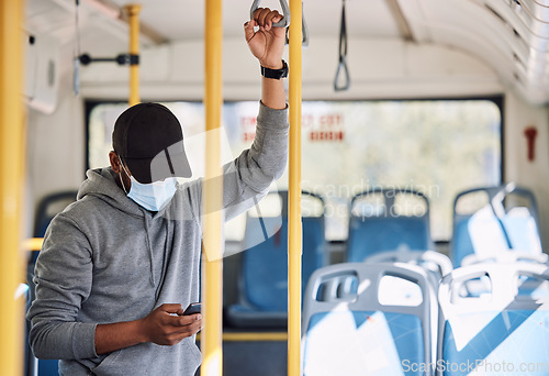 Image of Man in bus with mask, phone and reading on morning travel to city, checking service schedule or social media. Public transport safety in covid, urban commute and person in standing with smartphone.