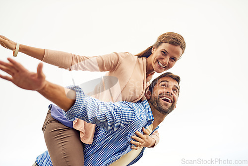 Image of Couple, piggy back and smile for peace, outdoors and vacation or holiday, date and bonding for love. Happy people, play and freedom on trip, airplane and connection in marriage, support and trust