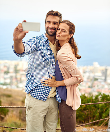 Image of Couple, hug and selfie on vacation, phone and outdoors on adventure, love and memories for social media. Happy people, smartphone and bonding or technology, travel and holiday or pout on date
