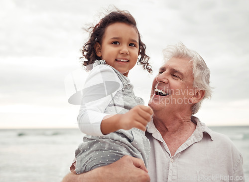 Image of Beach, happy and elderly man with his grandchild on a family vacation during spring time. Travel, happiness and retired grandfather holding a girl child in nature by the sea while on holiday.