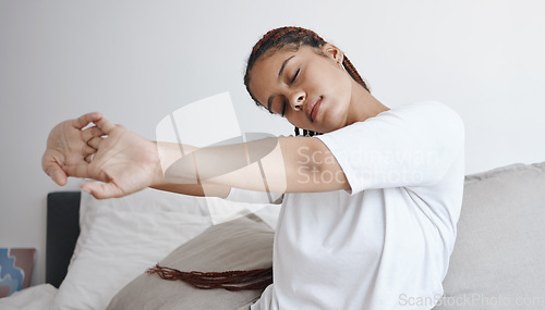 Image of Health, wellness and zen, woman stretching on bed in the morning to start new day. Motivation to get up, young student stretching before going to school. Mental preparation in the bedroom to wake up.