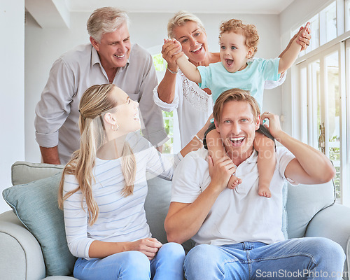 Image of Children, family and baby with grandparents, a child and his parents during a visit while sitting on a sofa in a living room. Kids, happy and smile with a senior man and woman at home with relatives