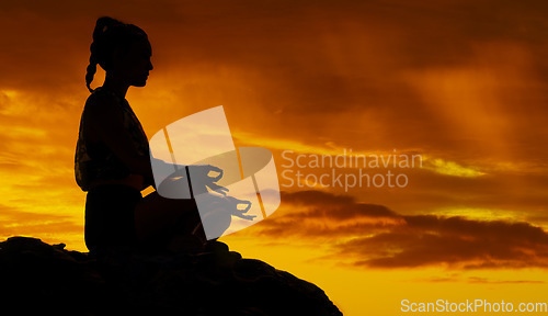 Image of Yoga, mountain and meditation with silhouette of woman at sunset for peace, mind and zen in nature. Freedom, landscape and energy with girl relax after hiking for health, wellness and motivation