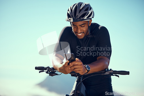 Image of Bicycle, phone and fitness or gps app with smile happy about progress during exercise and cycling training outdoors in summer with safety helmet. Athlete riding bike to workout and practice for race