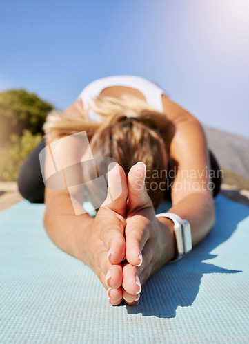 Image of Stretching, yoga and wellness woman hands with outdoor nature, sunshine lens flare and sky mock up. Exercise, fitness and calm person meditation on ground for workout, pilates or training in nature