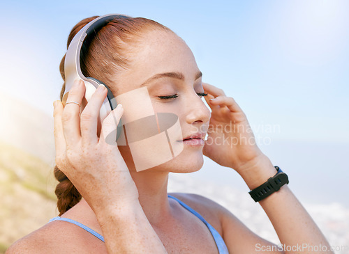 Image of Woman, music and zen podcast during meditation in nature, relax and calm with blue sky views. Radio, wellness and yoga by girl enjoying a break with calming audio on a fitness workout alone in summer