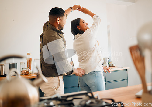 Image of Dancing, romance and playful couple having fun, love and bonding while laughing, spinning and twirling together at home. Loving husband enjoying care, affection and joy while relaxing with happy wife