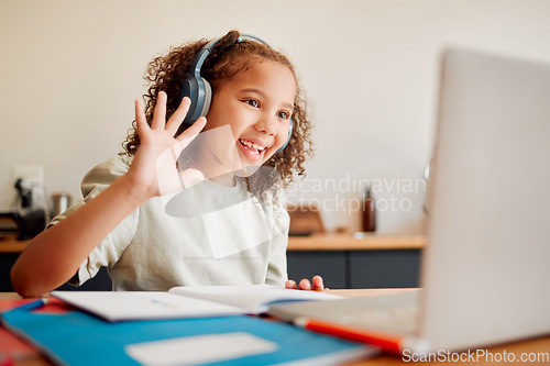 Image of Online, distance learning child on laptop webcam or video call joining lesson with headphones and hello greeting or goodbye gesture. Little happy student in remote classroom with a teaching notebook