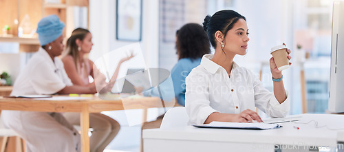 Image of Casual, creative and digital marketing agency businesswoman working in modern office, with colleagues. Professional female manager of advertising company, reading emails and drinking coffee