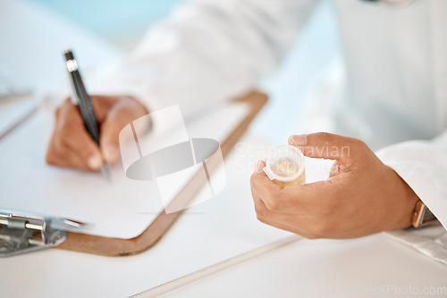 Image of Prescription, pharmacy and medicine with doctor, healthcare worker or physician handing drugs treatment. Pharmacist or medical specialist writing out form for recovery, cure or antibiotics