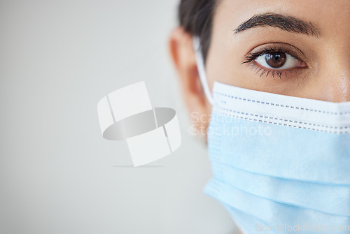 Image of Health, wellness and covid safety mask of a young woman face and head. Eye zoom of a female with nose and mouth cover for prevention and protection from corona virus, flu and cold in a pandemic