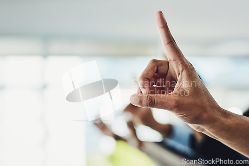 Image of Raising hand and finger to ask a business question in a modern office. Closeup of group of colleagues with raised fingers at a conference meeting or seminar with bright ideas over copy space.