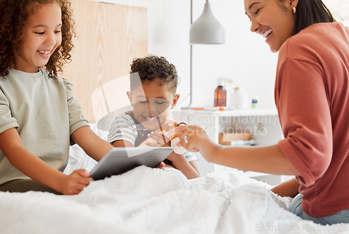 Image of Mother, daughter and son on a tablet relaxing in their home, watching fun cartoons and spending time together. Happy family, on a digital device learning and playing a game in the childrens bedroom.