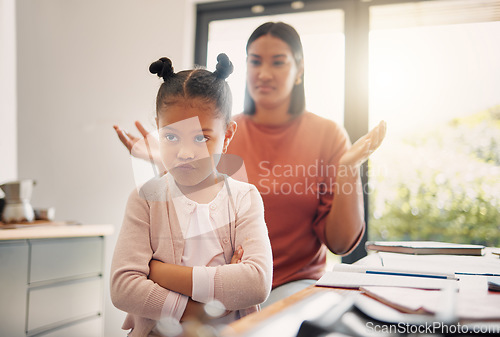 Image of Upset, discipline and family while offended and stubborn little girl looking unhappy with her scolding mother in the background. Naughty, problem and bad child angry and ignoring her parent at home