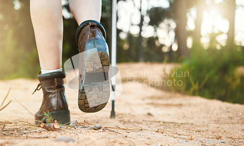 Image of Hiking, walking and active feet closeup of an outdoors hike, walk and adventure on a mountain trail. Relaxing, freedom and carefree activity outside in nature on a sunny summer day in the mountains