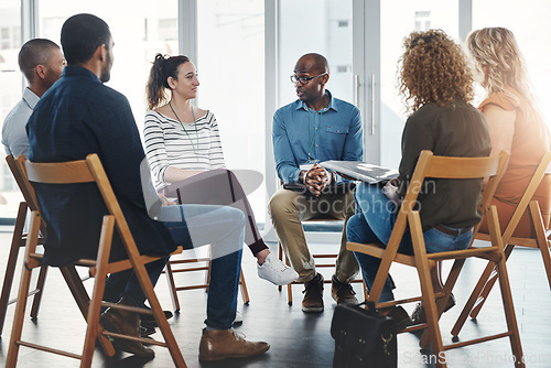 Image of A group therapy session with diverse people sharing their sad problems and stories. People sitting in a circle talking about their mental health issues and looking for support, help and counseling