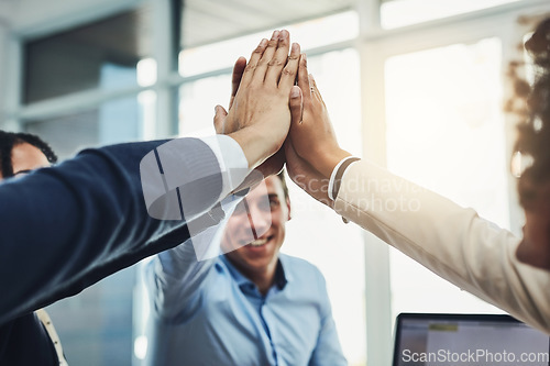 Image of Teamwork, partnership and fun with a diverse group joining hands for a high five during team building. Colleagues uniting and showing support, community and global collaboration in an office