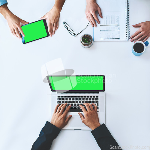 Image of Businesspeople on tablet and laptop with green screen showing marketing, advertising or copyspace from above. Top of hands typing, using wireless tech for online app, website or new modern software